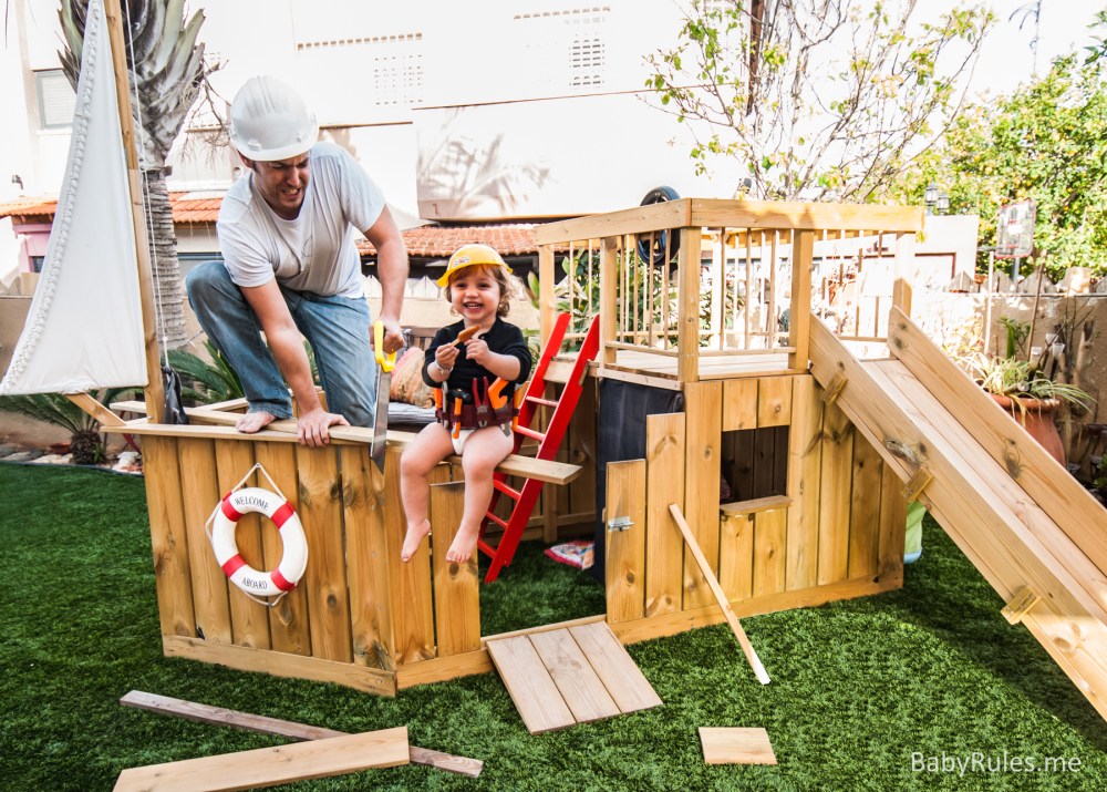 Father and daughter building a wooden pirate ship