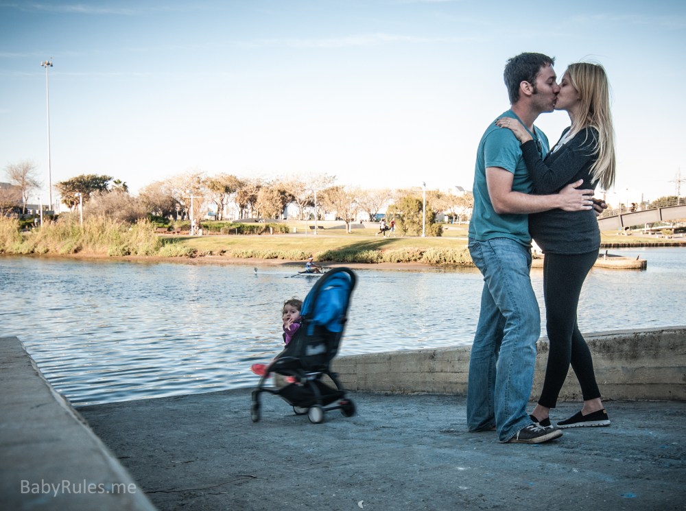 Couple kissing and baby falls to water